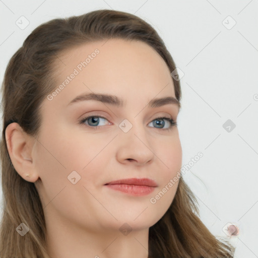 Joyful white young-adult female with long  brown hair and blue eyes