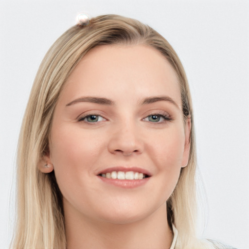 Joyful white young-adult female with long  brown hair and blue eyes