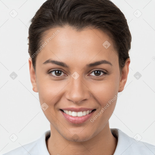 Joyful white young-adult female with short  brown hair and brown eyes