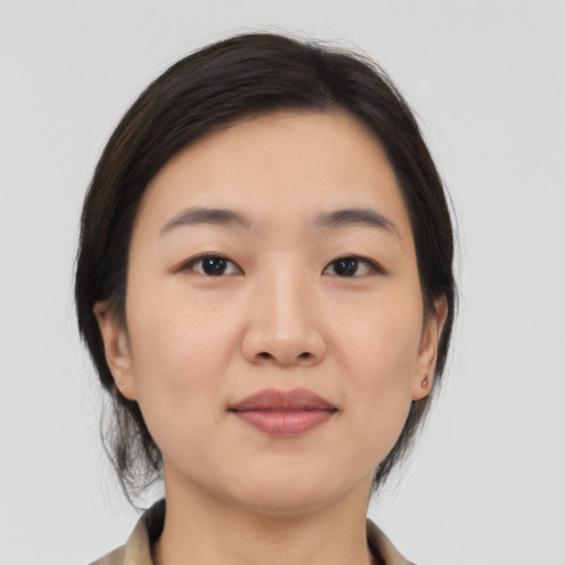 Joyful white young-adult female with medium  black hair and brown eyes