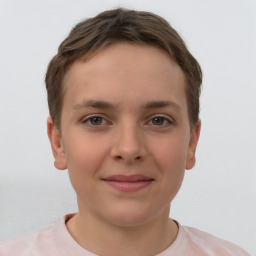 Joyful white child female with short  brown hair and brown eyes