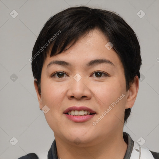 Joyful asian young-adult female with short  black hair and brown eyes