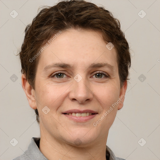 Joyful white adult female with short  brown hair and grey eyes