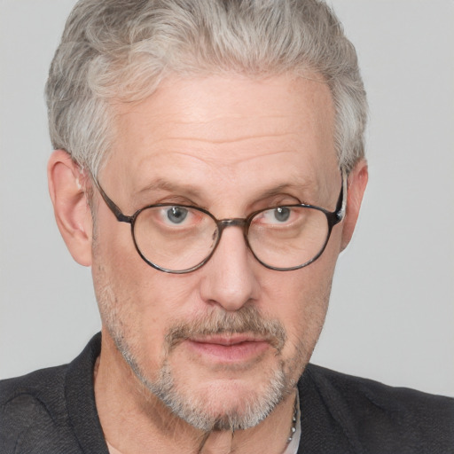 Neutral white middle-aged male with short  gray hair and blue eyes