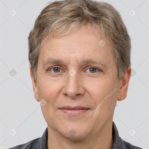 Joyful white middle-aged male with short  brown hair and brown eyes