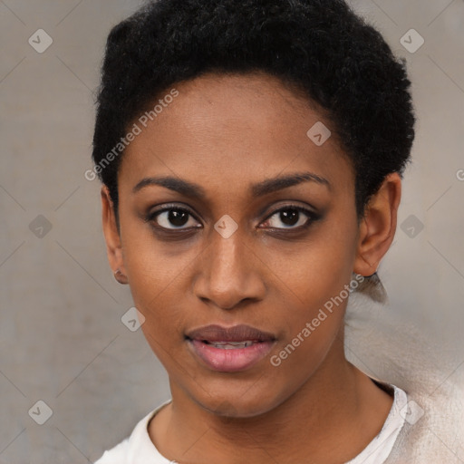 Joyful black young-adult female with short  black hair and brown eyes