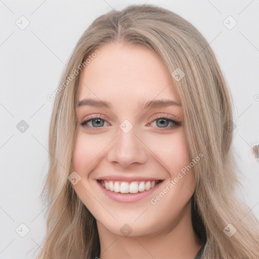 Joyful white young-adult female with long  brown hair and blue eyes