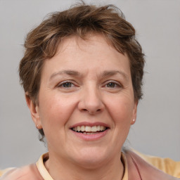 Joyful white adult female with short  brown hair and brown eyes