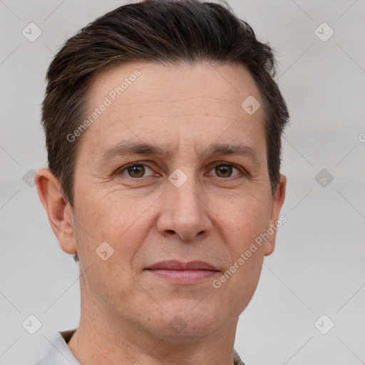 Joyful white adult male with short  brown hair and brown eyes