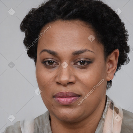 Joyful black adult female with short  brown hair and brown eyes