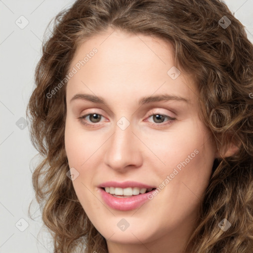 Joyful white young-adult female with long  brown hair and green eyes