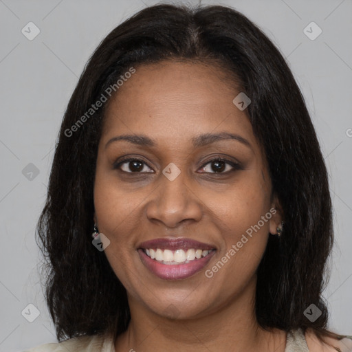 Joyful black young-adult female with medium  brown hair and brown eyes