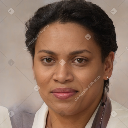 Joyful latino adult female with short  brown hair and brown eyes