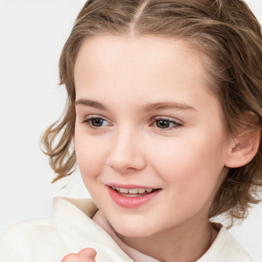 Joyful white child female with medium  brown hair and brown eyes