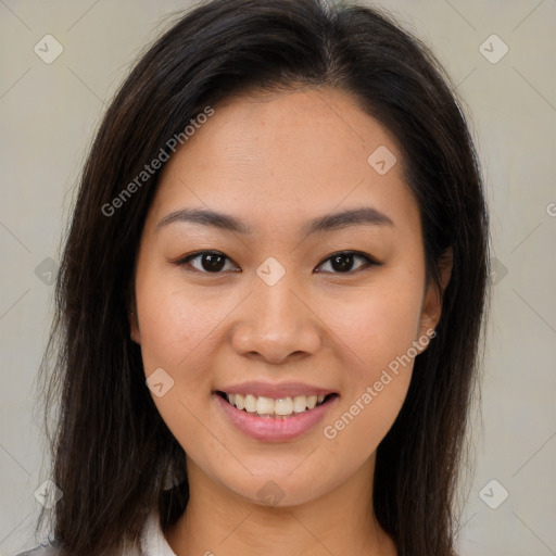 Joyful asian young-adult female with long  brown hair and brown eyes