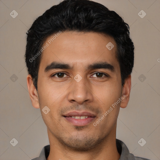 Joyful latino young-adult male with short  black hair and brown eyes