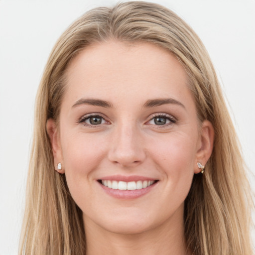 Joyful white young-adult female with long  brown hair and blue eyes