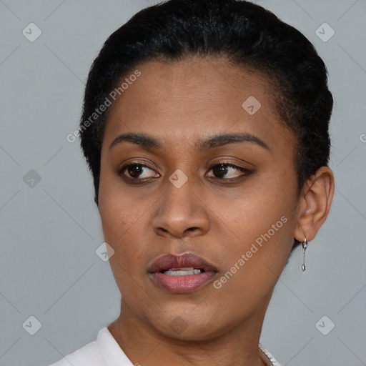 Joyful latino young-adult female with short  brown hair and brown eyes