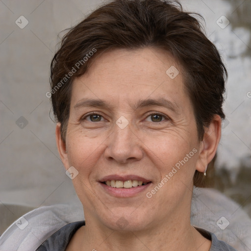 Joyful white adult female with short  brown hair and brown eyes