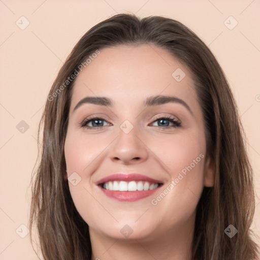 Joyful white young-adult female with long  brown hair and grey eyes