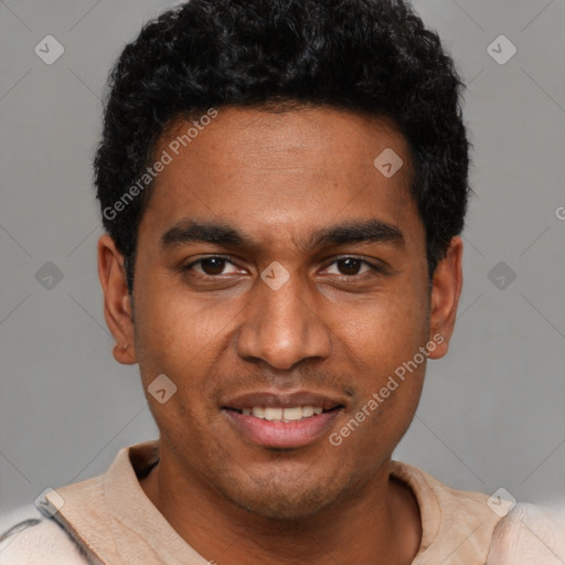 Joyful black young-adult male with short  black hair and brown eyes