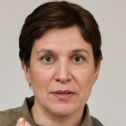 Joyful white adult female with short  brown hair and grey eyes