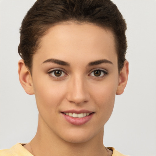 Joyful white young-adult female with short  brown hair and brown eyes