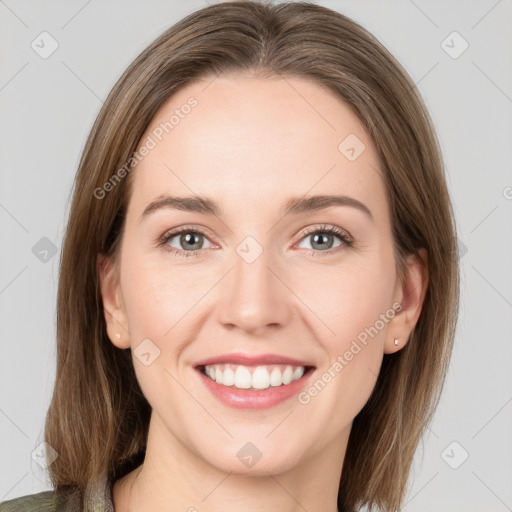 Joyful white young-adult female with medium  brown hair and green eyes