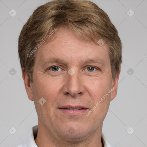 Joyful white adult male with short  brown hair and grey eyes