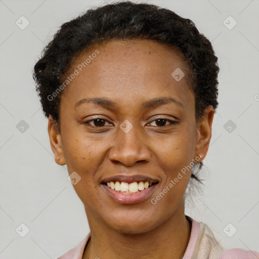 Joyful black young-adult female with short  brown hair and brown eyes