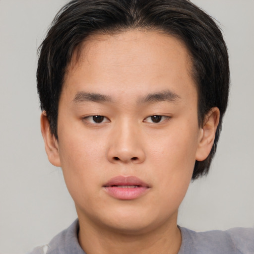 Neutral asian young-adult male with short  brown hair and brown eyes