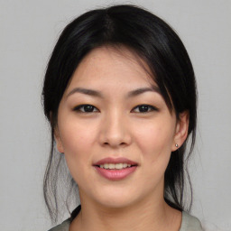 Joyful asian young-adult female with medium  black hair and brown eyes