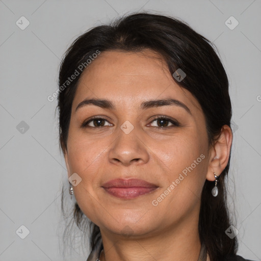 Joyful latino adult female with medium  brown hair and brown eyes