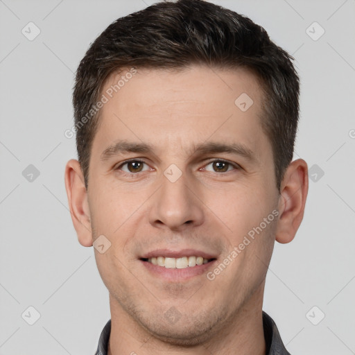 Joyful white young-adult male with short  brown hair and brown eyes