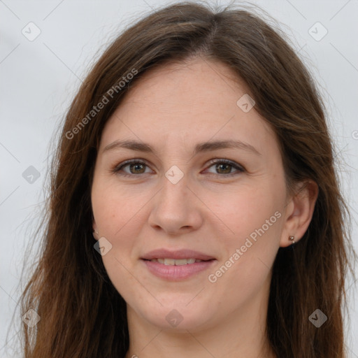 Joyful white adult female with long  brown hair and brown eyes