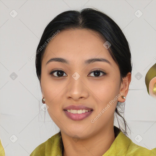 Joyful asian young-adult female with long  black hair and brown eyes