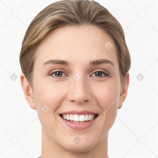 Joyful white young-adult female with short  brown hair and grey eyes