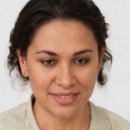 Joyful white adult female with medium  brown hair and brown eyes