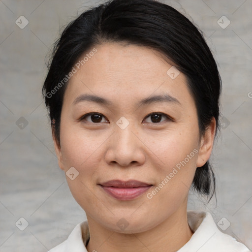 Joyful asian young-adult female with medium  black hair and brown eyes