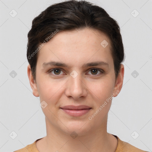 Joyful white young-adult female with short  brown hair and brown eyes