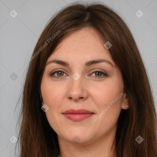 Joyful white adult female with long  brown hair and brown eyes