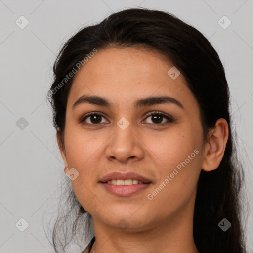 Joyful latino young-adult female with long  brown hair and brown eyes