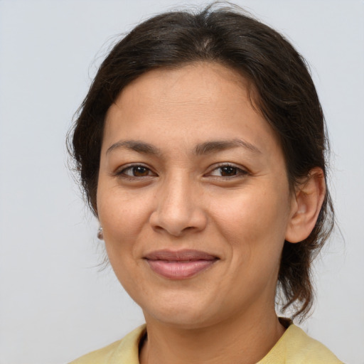 Joyful white young-adult female with medium  brown hair and brown eyes