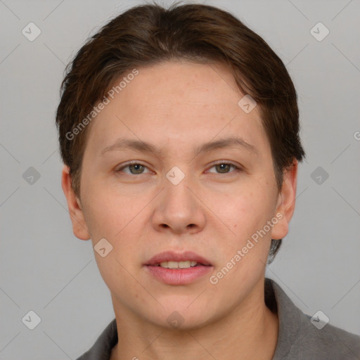 Joyful white adult female with short  brown hair and grey eyes