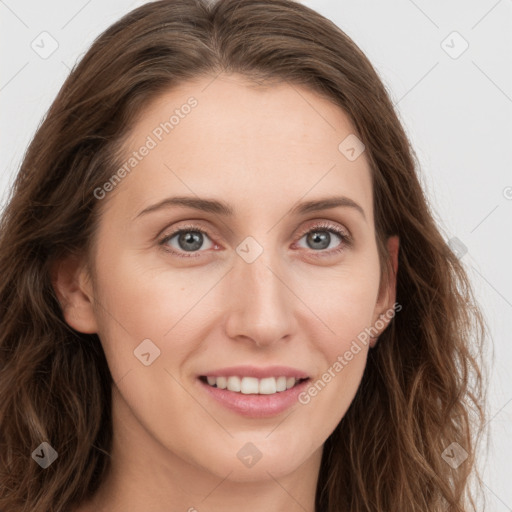 Joyful white young-adult female with long  brown hair and blue eyes