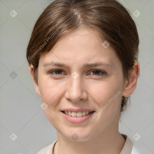 Joyful white young-adult female with medium  brown hair and grey eyes