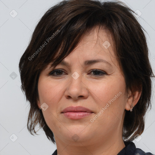 Joyful white adult female with medium  brown hair and brown eyes