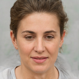 Joyful white adult female with short  brown hair and brown eyes