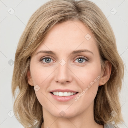 Joyful white young-adult female with medium  brown hair and blue eyes