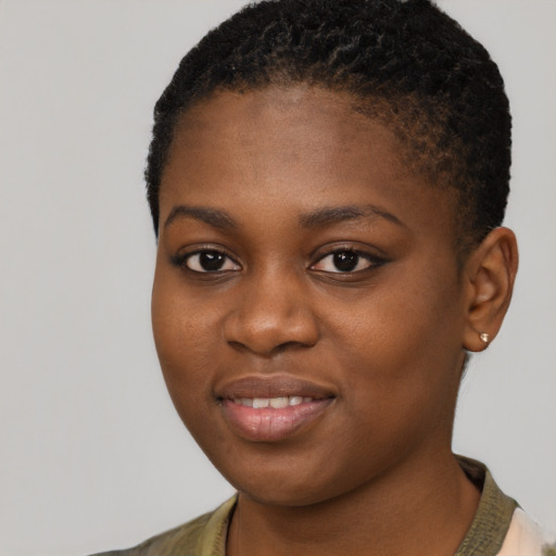 Joyful black young-adult female with short  brown hair and brown eyes